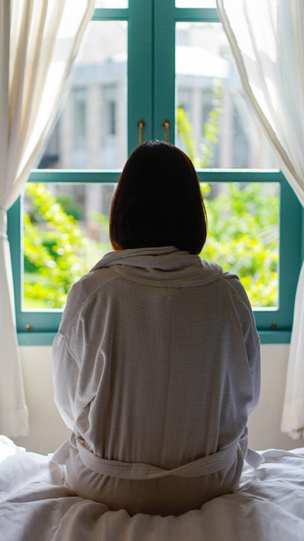 A lady looking out of a window