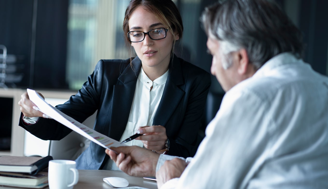 Trust Registration Service - A lady adviser advising a male customer