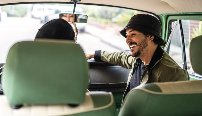 Man smiling with a hat on